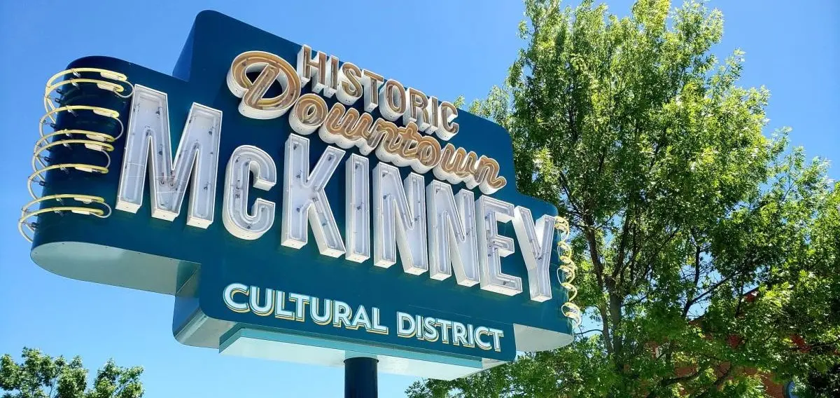 Historic Downtown McKinney, TX Cultural District sign, McKinney Cleaning Co service area across Collin County